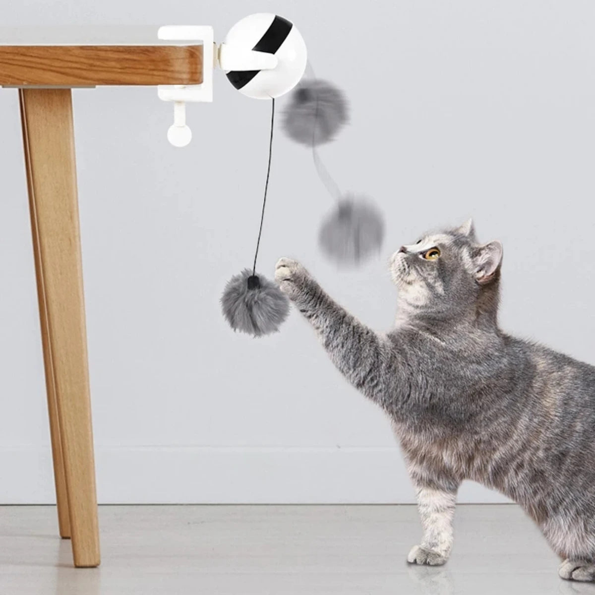 Get Your Cat's Paws in the Game with the 1Pc Lifting Ball Electric Motion Cat Toy – Round and Round They Go!